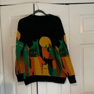 Black and Green Crewneck Sweater with Vibrant Pattern